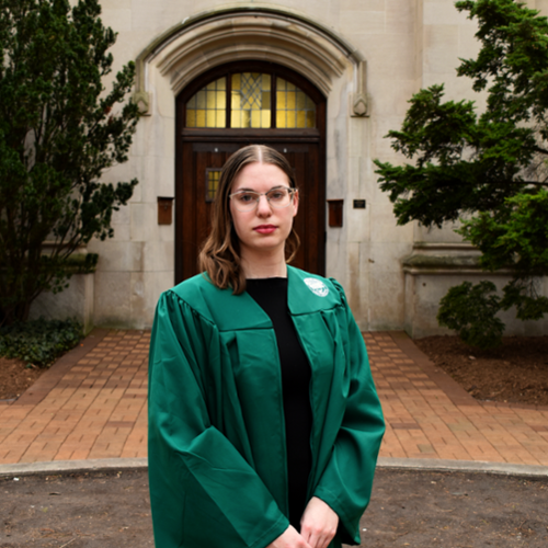 Photo of Natalie Hollis in front of Beaumont Tower on MSU's campus